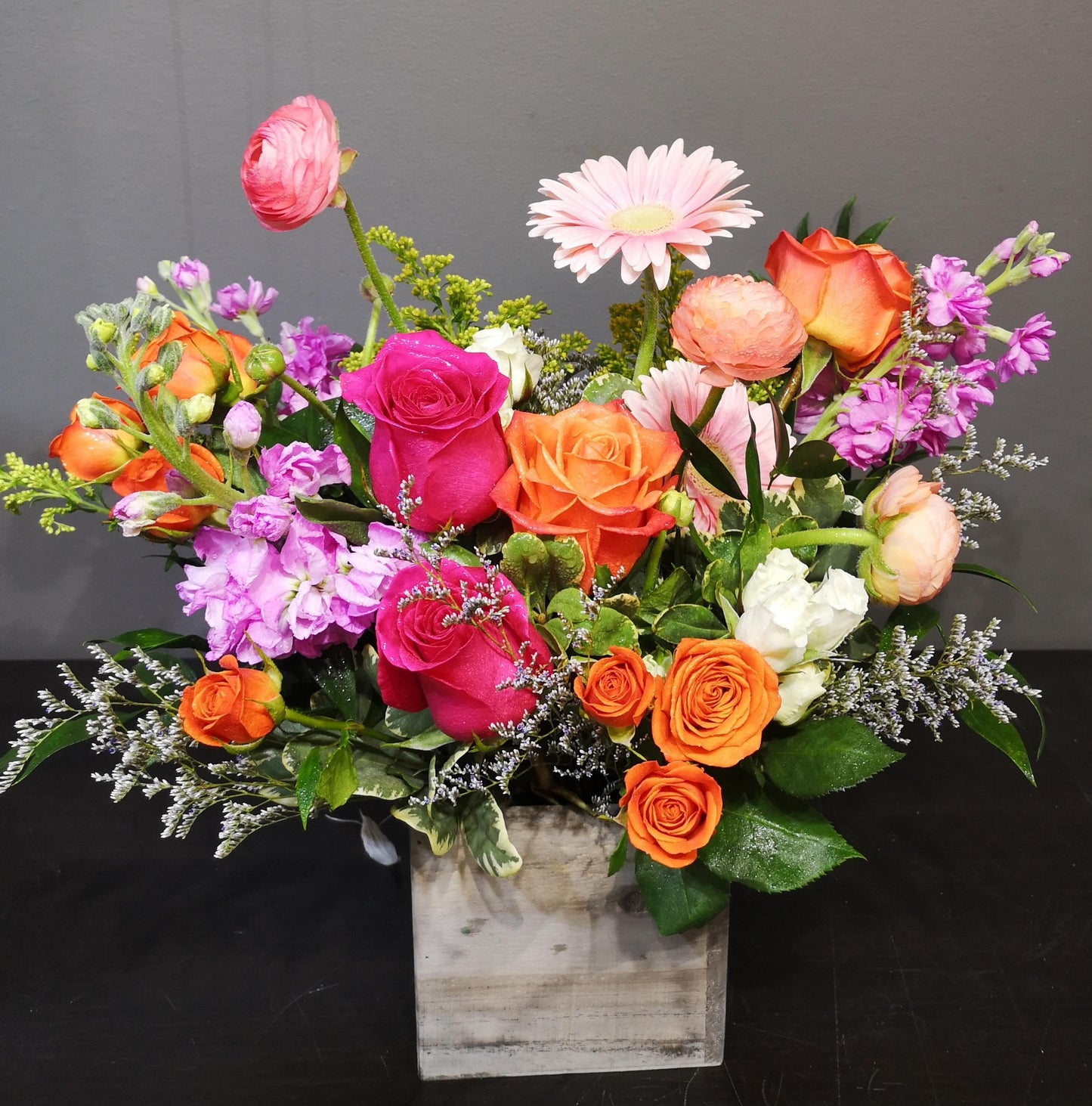 Spring wood box arrangement