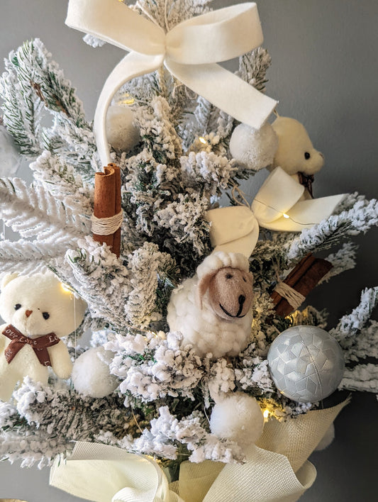 Artificial white Christmas tree with wool toys