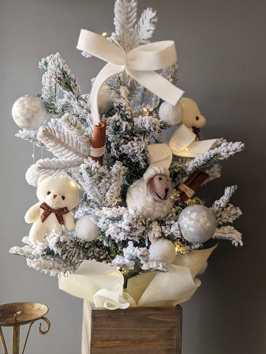 Artificial white Christmas tree with wool toys